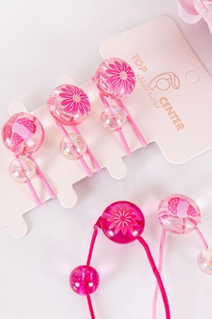 ربطة شعر 6 حبات مزيج من اللون الوردي الفاتح و الغامق على شكل كرات شفافة لامعة مزينة بأشكال مختلفة 