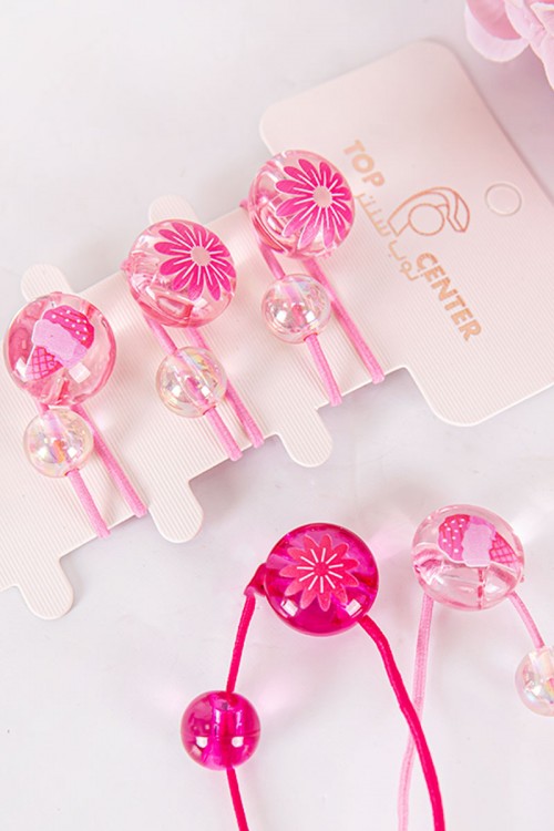 ربطة شعر 6 حبات مزيج من اللون الوردي الفاتح و الغامق على شكل كرات شفافة لامعة مزينة بأشكال مختلفة