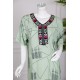 قميص نسائي طويل لون أخضر فاتح مزين بخطوط رفيعة بياقة كلفة مطرزة ذو أكمام قصيرة