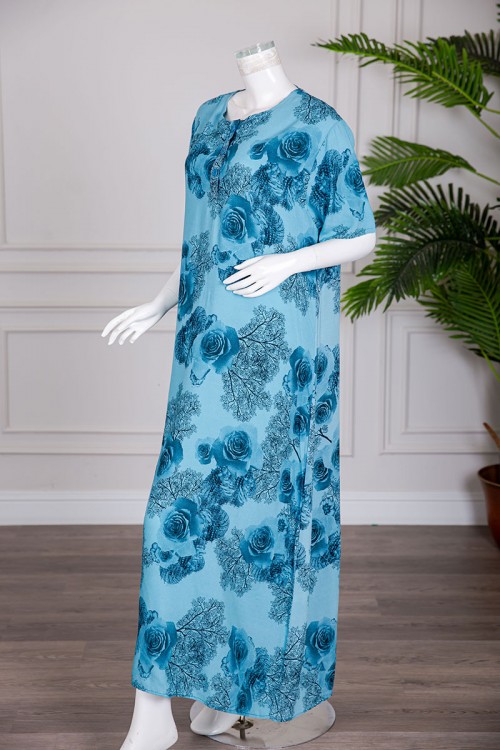 قميص نسائي طويل لون سماوي مشجر بياقة دائرية و بأزرار من الأمام و أكمام قصيرة