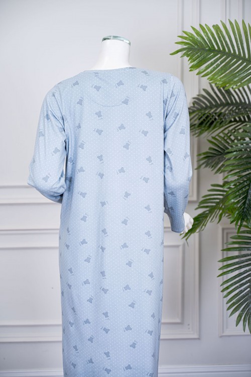 قميص نسائي طويل لون سماوي مزين بكتابات ورسومات ياقة دائرية و بأكمام طويلة