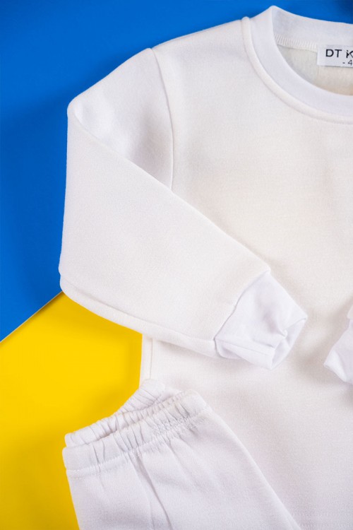 بيجاما أطفال شتوي قطعتين لون أبيض بلوزة بياقة دائرية و أكمام طويلة مع بنطلون طويل