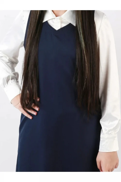 مريول ثانوي سادة بقصه مثلث بجيوب اماميه