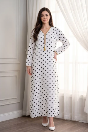 Women's multi-colored jalabiya with black polka dots, decorated with trim on the collar and sleeves.