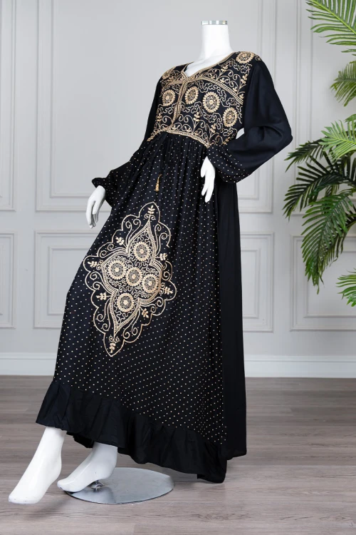 Long black women's *jalabiya* (oversized fit), featuring gold embroidery and patterns