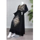 Long black women's *jalabiya* (oversized fit), featuring gold embroidery and patterns