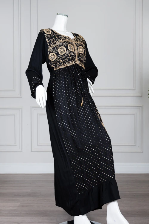 Long black women's *jalabiya* (oversized fit), featuring gold embroidery and patterns
