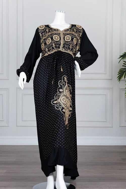 Long black women's *jalabiya* (oversized fit), featuring gold embroidery and patterns