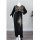 Long black women's *jalabiya* (oversized fit), featuring gold embroidery and patterns