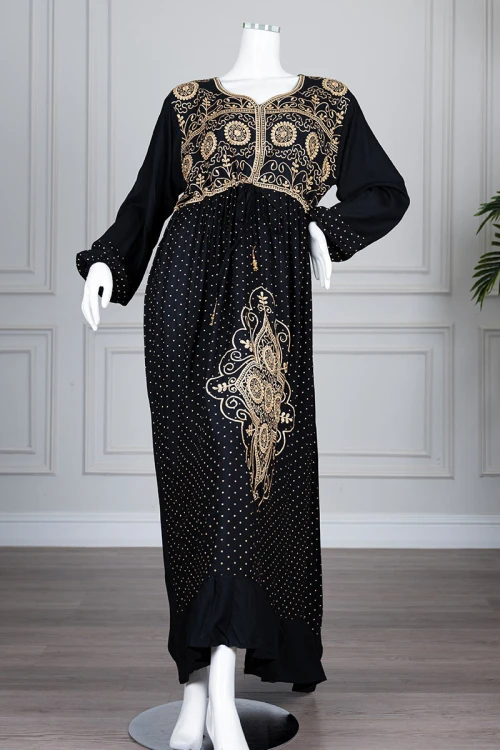 Long black women's *jalabiya* (oversized fit), featuring gold embroidery and patterns