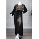 Long black women's *jalabiya* (oversized fit), featuring gold embroidery and patterns