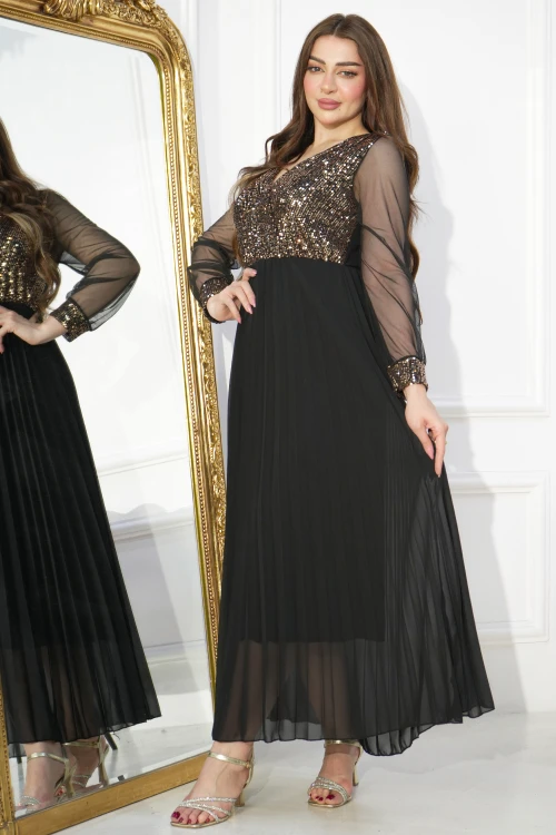 فستان سهرة نسائي ذهبي طويل أنيق أكمام طويلة شفافة وقماش لامع من الصدر بكسرات سفلية أمامية