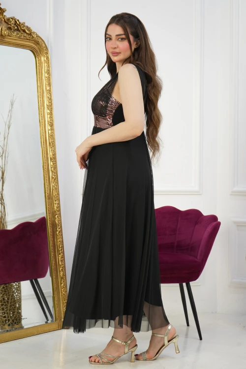 فستان سهرة نسائي نحاسي طويل أنيق أكمام طويلة شفافة وقماش لامع من الصدر بكسرات سفلية أمامية