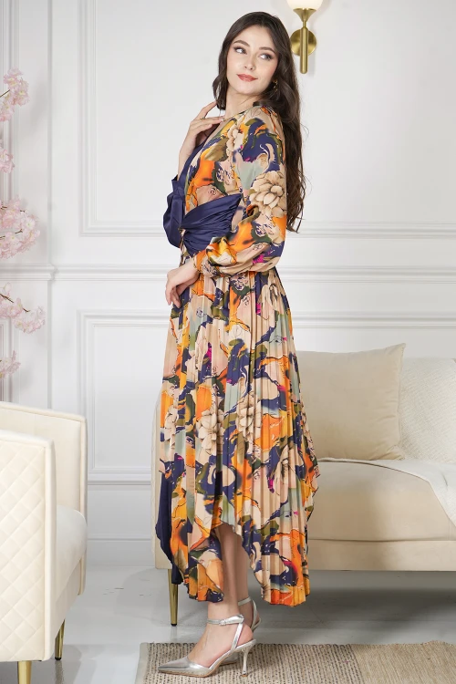 فستان نسائي أنيق قماش مشجر مدموج مع قماش سادة كحلي بحركة مميزة على الخصر وكسرات من الأسفل و أكمام طويلة بأزرار قفل