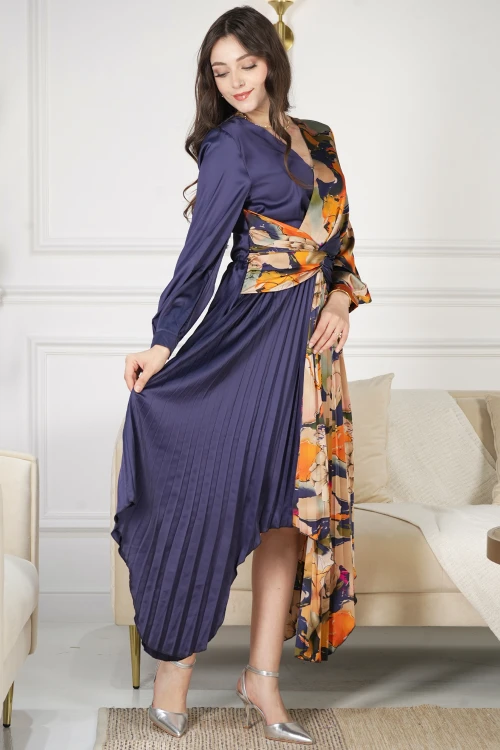 فستان نسائي أنيق قماش مشجر مدموج مع قماش سادة كحلي بحركة مميزة على الخصر وكسرات من الأسفل و أكمام طويلة بأزرار قفل