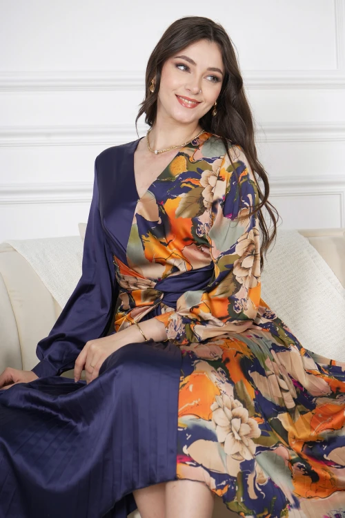 فستان نسائي أنيق قماش مشجر مدموج مع قماش سادة كحلي بحركة مميزة على الخصر وكسرات من الأسفل و أكمام طويلة بأزرار قفل