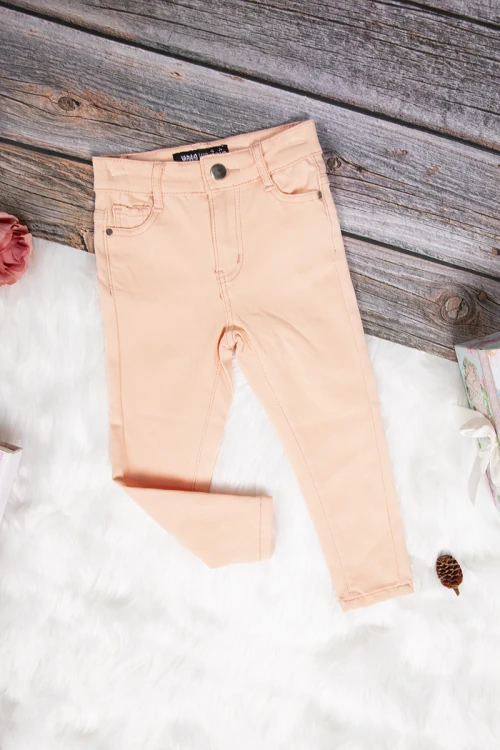 بنطلون بناتي سكيني أنيق لون برتقالي فاتح بجيوب من الأمام والخلف وسحاب و زر قفل