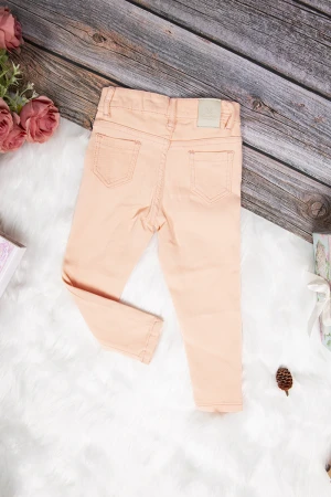 بنطلون بناتي سكيني أنيق لون برتقالي فاتح بجيوب من الأمام والخلف وسحاب و زر قفل
