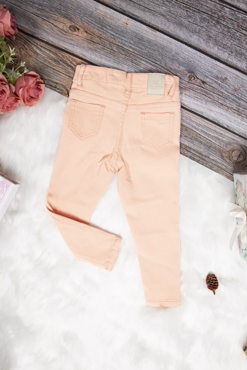 بنطلون بناتي سكيني أنيق لون برتقالي فاتح بجيوب من الأمام والخلف وسحاب و زر قفل