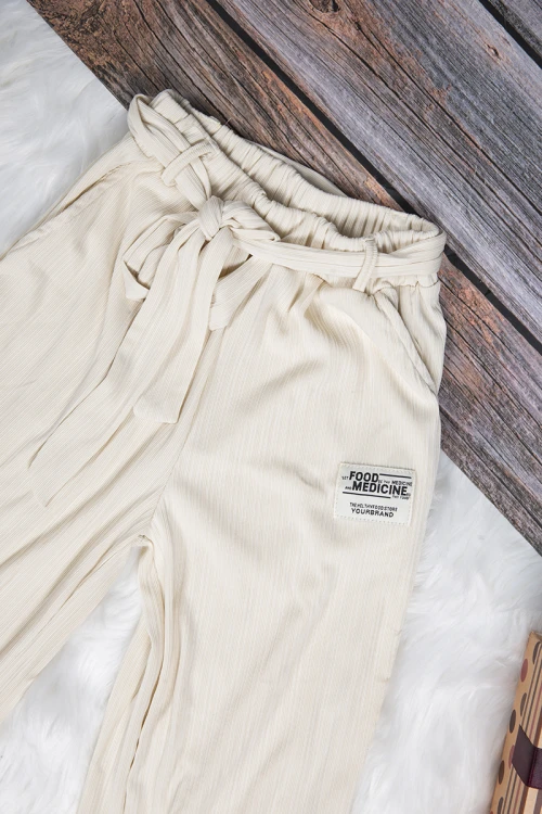 بنطلون بناتي واسع أنيق لون بيج بجيوب من الأمام و رباط على الخصر