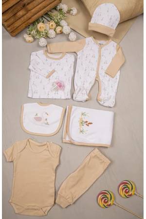 طقم أفرول مواليد 7 قطع لون مشمشي مزينة برسومات كرتونية