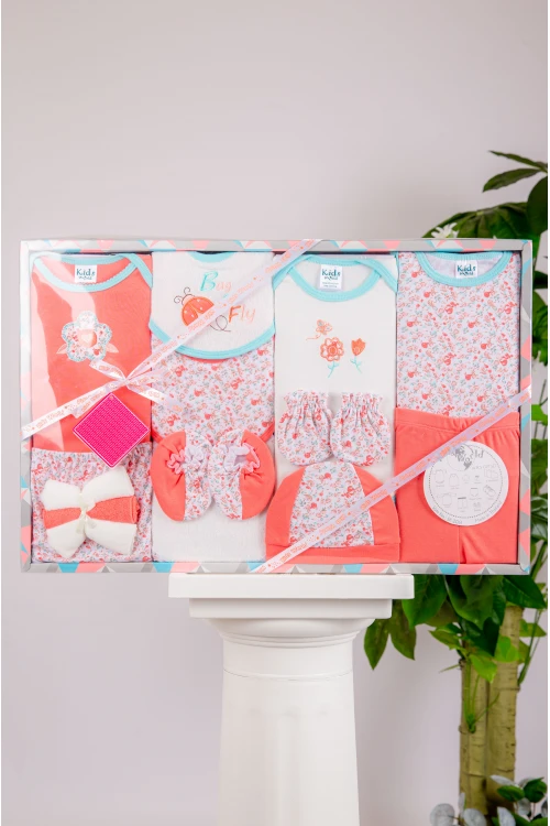 طقم هدايا مواليد 14 قطعة لون برتقالي وأبيض مزينة برسومات كرتونية