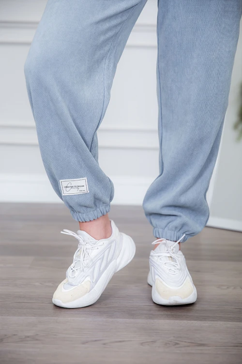 طقم نسائي شتوية قطعتين لون كحلي مزينة بالنجوم ذو أكمام طويلة و بنطلون بزم و رباط من الخصر