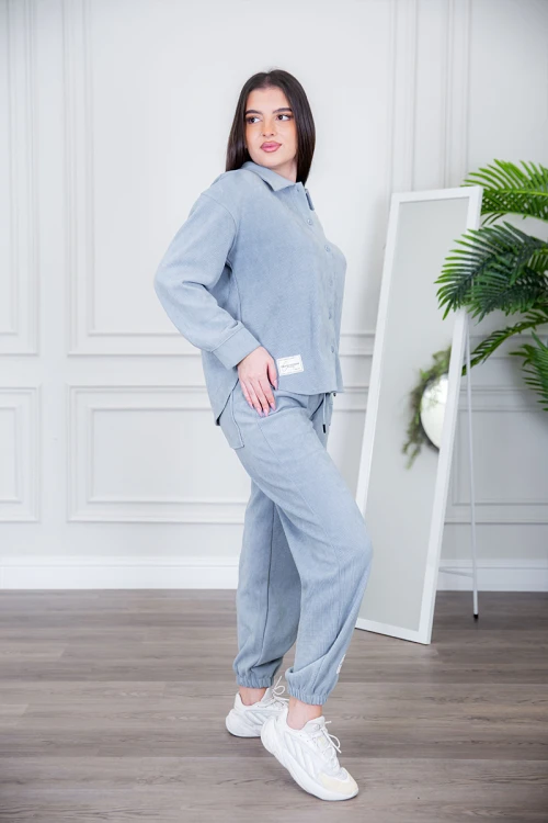 طقم نسائي شتوية قطعتين لون كحلي مزينة بالنجوم ذو أكمام طويلة و بنطلون بزم و رباط من الخصر