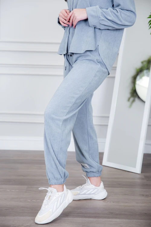 طقم نسائي شتوية قطعتين لون كحلي مزينة بالنجوم ذو أكمام طويلة و بنطلون بزم و رباط من الخصر