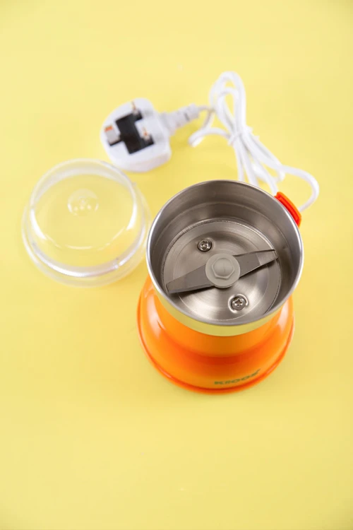 مطحنة قهوة لون برتقالي بوعاء و شفرات من الفولاذ المقاوم للصدأ