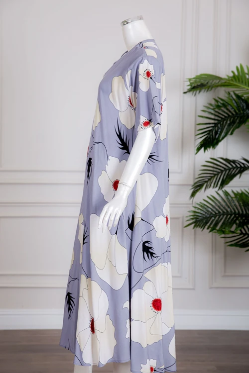 قميص نسائي متعدد الألوان مزين بطبعات من الورود بياقة سبعة و أكمام قصيرة