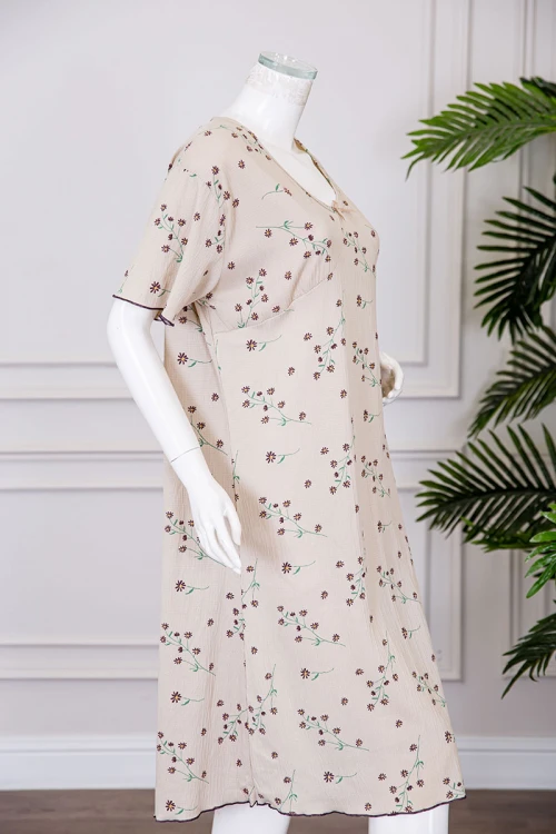 قميص نسائي ميدي لون بيج مشجر ياقة دائرية مزينة بفيونكة و بأكمام قصيرة