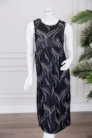 قميص نسائي قصير لون أسود مزين برسومات باللون البيج ياقة دائرية و بدون أكمام