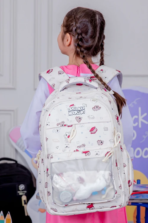 شنطة ظهر مدرسية بناتي لون بيج مزينة برسومات ملونة و بجيوب متعددة مع مقلمة