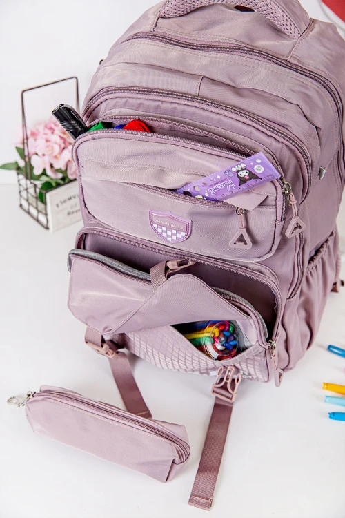 شنطة ظهر مدرسية متعددة الألوان بجيوب متعددة مع مقلمة