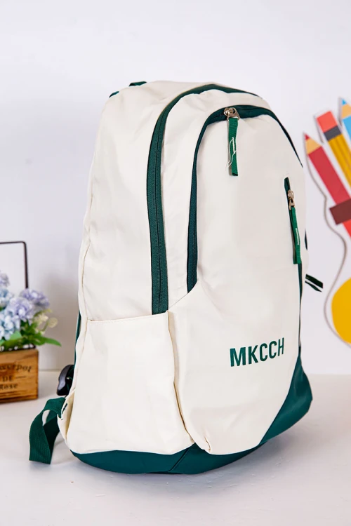 شنطة ظهر مدرسية لون بيج فاتح بحواف أخضر غامق و بجيوب متعددة