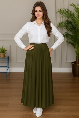 مريول بناتي مدرسي مرحلة المتوسط قطعتين قميص أبيض بياقة مطوية و بأزرار من الأمام و الأكمام و تنورة لون زيتي بكسرات و خصر مزموم 