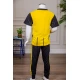 طقم ولادي رياضي قطعتين تيشيرت لون أصفر مقلم باللون الأسود و بنطلون طويل لون أسود مخطط باللون الأصفر من الجانبين و بزم من الأسفل