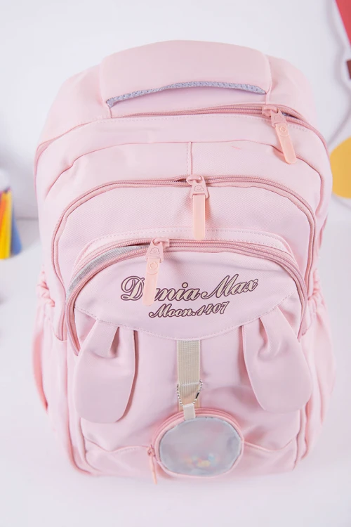 شنطة ظهر مدرسية بناتي لون وردي بجيوب متعددة مع محفظة دائرية