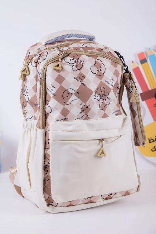 شنطة ظهر مدرسية بناتي لون بيج مزينة برسومات و كتابات بجيوب متعددة مع مقلمة