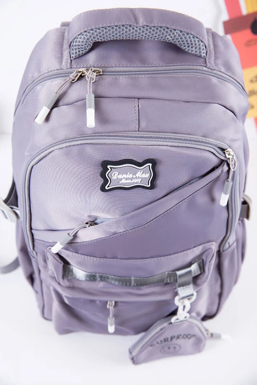 شنطة ظهر مدرسية متعددة الألوان بجيوب متعددة مع محفظة صغيرة