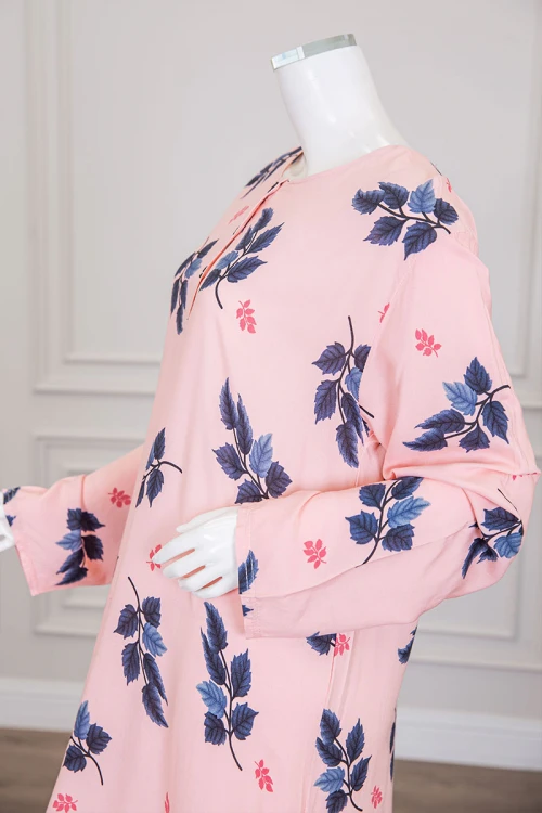 قميص نسائي طويل لون خربزي مشجر ياقة دائرية بأزرار من الأمام و أكمام طويلة