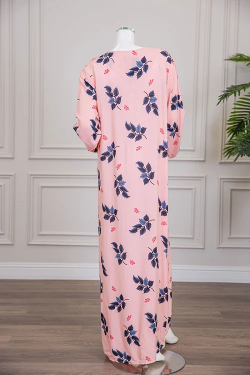 قميص نسائي طويل لون خربزي مشجر ياقة دائرية بأزرار من الأمام و أكمام طويلة