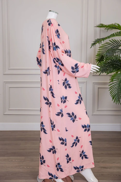 قميص نسائي طويل لون خربزي مشجر ياقة دائرية بأزرار من الأمام و أكمام طويلة