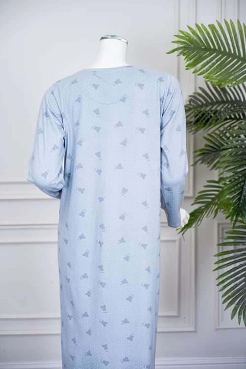 قميص نسائي طويل لون سماوي مزين بكتابات ورسومات ياقة دائرية و بأكمام طويلة