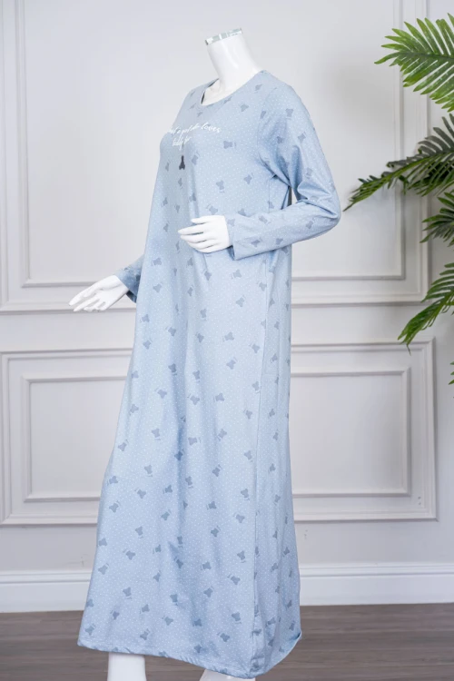 قميص نسائي طويل لون سماوي مزين بكتابات ورسومات ياقة دائرية و بأكمام طويلة