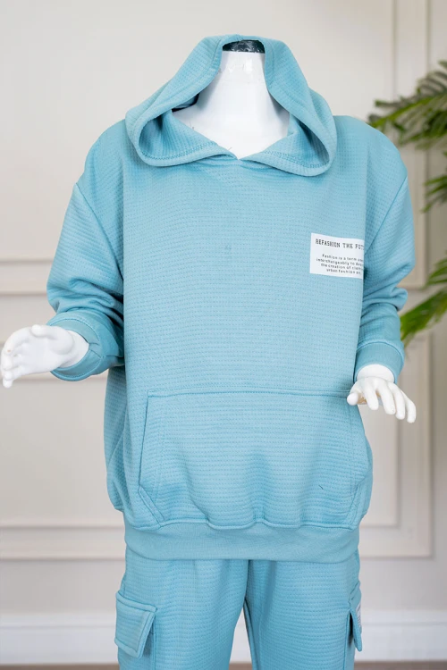 طقم بناتي شتوي قطعتين لون تركواز هودي بقبعة متصلة و بجيوب الكنغر و أكمام طويلة مع بنطلون طويل بجيوب من الجانبين