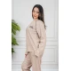 بيجاما نسائية قطعتين لون بيج مزينة بكتابات وخطوط باللون الأسود من الأمام ياقة دائرية و بأكمام طويلة مع بنطلون طويل