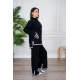 طقم تريكو نسائي شتوي قطعتين لون أسود مزين من الأطراف باللون الأبيض ياقة عالية مع بنطلون طويل