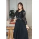 فستان نسائي لون أسود جاكيت رسمي دانتيل ياقة دائرية و بأكمام طويلة مزينة بأزرار ذهبية و بحزام في الخصر مع تنورة شيفون كسرات